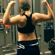 16 years old Powerlifter Heather Flexing biceps