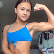 12 years old Fitness girl Dasha Flexing muscles